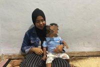 Siti Mauliah (37), orang tua yang bayinya tertukar di Bogor setelah satu tahun melahirkan. (Dok. Tribun Bogor) 